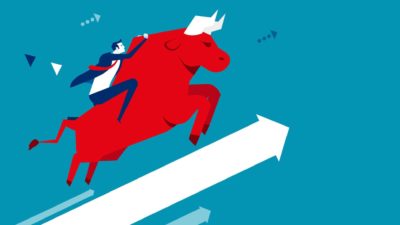 Concept image of a businessman riding a bull on an upwards arrow.